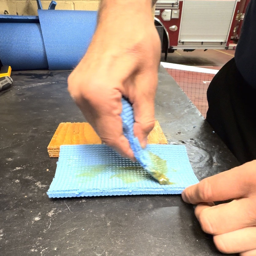 Apply contact cement to wooden block and foam pad of canoe yoke